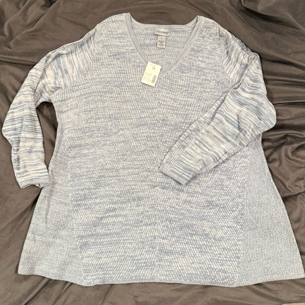 Catherine’s Light Blue and White V-Neck Sweater